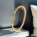 Gold-Plated Bangle with Green Crystal Accents 1